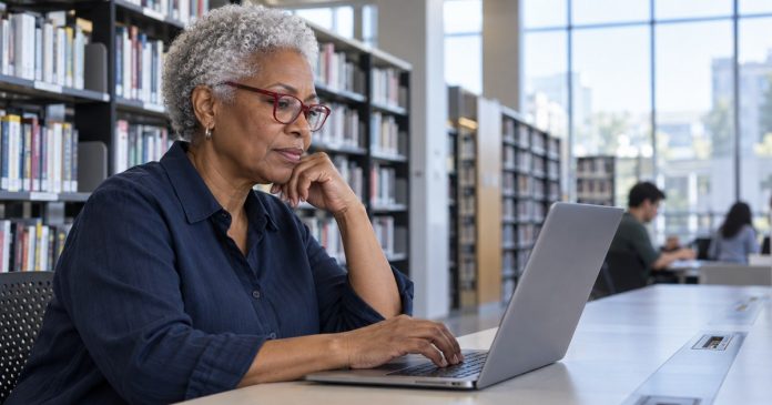 Writing a private and useful psychic review Woman considering a review on her laptop in a library